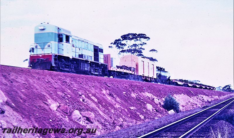 P20746
H class 4  (original light blue livery) hauling a standad gauge construction train near Woolundra. EGR line. 
