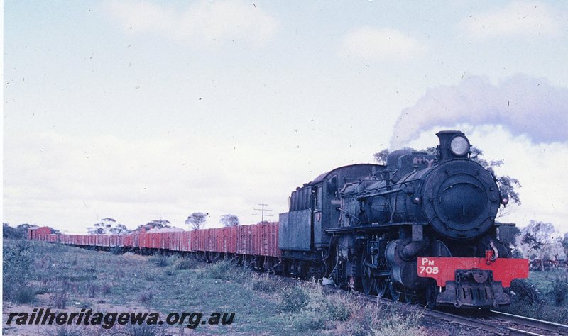 P20750
PM class 705 number 108 goods hauling a train of GM class wagons loaded with iron ore from Southern Cross to Wundowie. Location unknown. EGR line.
