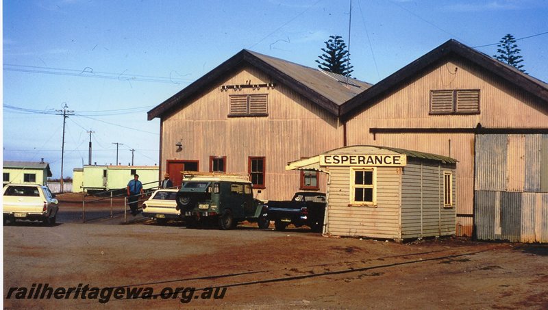 P20774
Esperance narrow gauge 1st class goods shed and passenger shelter. Station nameboard in photo. CE line.
