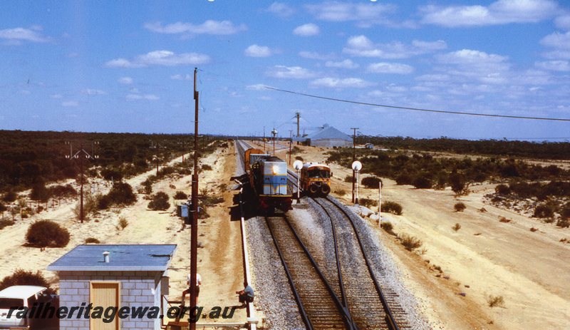 P20779
Moorine Rock - L class (later blue livery) hauling a short freight train crosses Sperry Rail Recorder car. EGR line.
