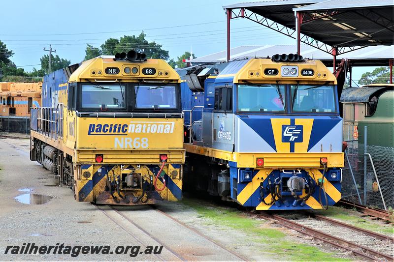 P21013
Pacific National loco NR class 68, side by side with CFL loco CF class 4406 parked next to each other on he tracks through the Rail Transport Museum, Bassendean, mainly a front on view.
