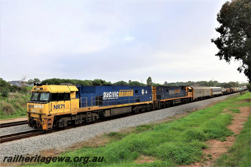 P21014
Pacific National loco NR class 71 in the yellow and blue livery double heading with another NR class on a south bound freight train passing through Hazelmere
