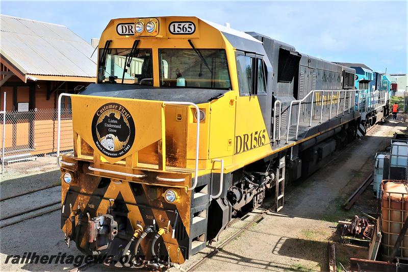 P21022
Watco Australia loco DR class 1565, yellow and black livery being towed by CBH Group CBH class 007 heading towards UGL's plant, Bassendean, front and side view..
