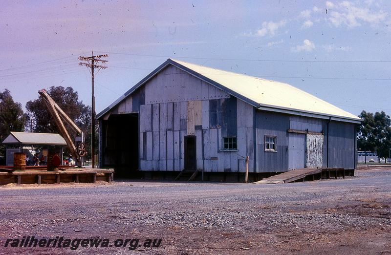 P21041
4 of 4 views of the 2nd Class goods shed at Pinjarra, SWR line, left hand end and rear view with the loading platform and the platform crane in the view
