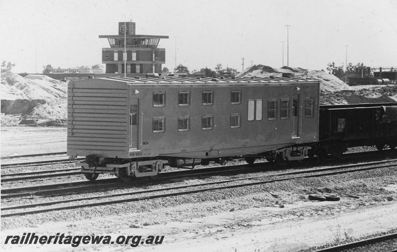 P21067
WSW class 30631 standard gauge crew living van, Forrestfield Yard when still under construction, end and side view, control tower in the background
