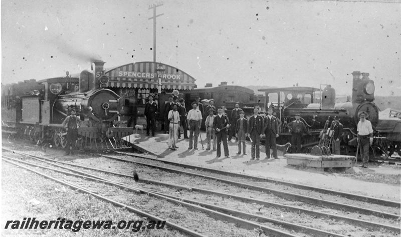 P21075
Station scene, G class loco on passenger train at platform, A class loco, van, station master J H Byrne with staff and passengers, shed, point levers, crossover, Spencers Brook, ER line. See P21076
