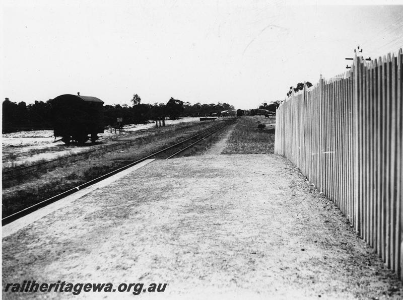 P21085
Platform, picket fence, van, track, Yellowdine, EGR line, looking east, c1940 
