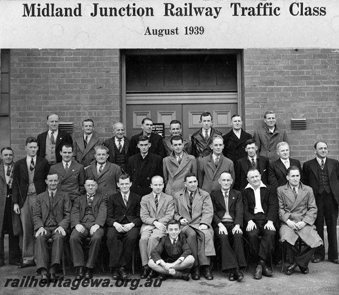 P21141
Midland junction Railway Traffic Class, Group Photograph: Back Row: (Left - Right) H. Lander, 2yr,; A. Chambers, 1yr.; J. Summerton, 2yr.; C. Franks, 2 yr.; D.G. Longoulant, 5 yr.; B. Blance, 1 yr.; C. Newling, 3rd yr.; C.R. Crofts (Patient) Second Row: (Left-Right) A. Corbett, 2 yr.; W.C. Shire, 1yr.  A. Davies, 6 yr.; C. Criddle, 5th yr.; W. McDavitt, 1 yr.; S. Fay, 1 yr.; R. A. McKenzie, 1st yr.; W. McCarthy, 1 yr.; T.C. Strebler, 10 yr.; H. Geoff, 3rd yr. Front Row: (Left-Right) R. Geer, 1st yr.; W. Shire (Secretary) 5 yr.; H. Polmear (Asst. Instructor) 10 yr.; Dr. Beech, Lecturer;  Dr. Kyle (Examiner) S.C. Scott, Instructor, 12 yr.; W. Webster, 2nd yr.; L. Gillam, 2nd yr.; Young Lad in Front, H. Gerloff (Patient) 
