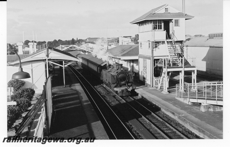 P21166
DM class 599 on a suburban passenger train heading towards Perth, Station buildings, elevated signal box, Subiaco, ER line elevated view along the track
