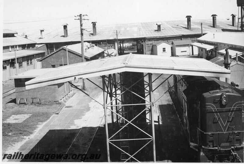 P21172
R class 1902, diesel refuelling point, roundhouse, administration building, Bunbury loco depot, SWR line, side and front view from elevated position, c1970s
