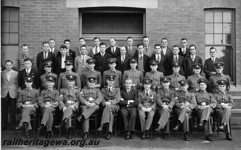 P21181
Group photo of St John Ambulance Brigade Overseas Railway Division No 3, Midland Junction and Ambulance Class, Railway Centre July, 1939. Back row - A. G. McDonald, A. B. Burrows, M. G. Bullen, M. M. Jones, M. Larwood, F. L. Harvey, E. G. Board, G. Lyall, A. H. V. Hicks. 3rd row - D. G. Henwoods, S. J. Berry, J. Middleton, A. F. J Burrows, P. Peirce, H. D. Gilchrist, J. A. Arnott, F. N. Greenwood, R. Budd, H. Anderson, R. A. Williamson. 2nd row - F. Flottman, A. Codalonga, Cpl. A. Genders, W. McHyde, H. Macliver, D. Power, J. Moore, E. D. Stock, G. Baynes, R. Woodward, W. M. McArthur. Front row - J. C. Hewitt, J. F. Goold, Cpl. S. C. Scott, Sgt J. H. Campbell, M. J. H. Woods, Dr. R. I. Greenham, Divi. Superintendent F. E. Guy, Cpl.A. Hyatt, Sgt W. T. Hyde, C. J. Hegney, L. C. Tippett.
