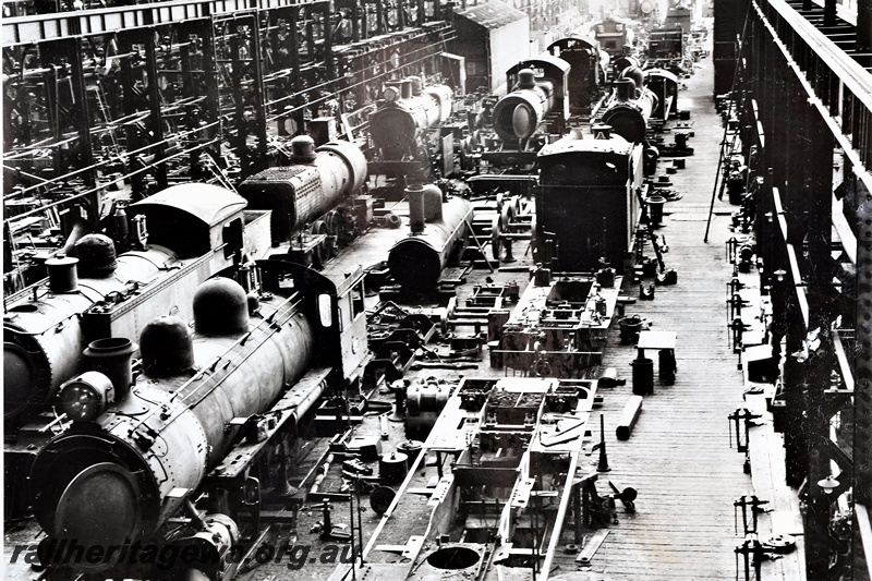 P21269
Many steam locomotives undergoing repairs, inside the Fitting Shop, Midland Workshops, ER line, view from elevated position, c1937
