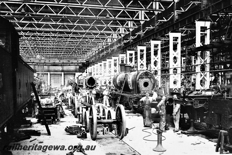 P21271
Several steam locomotives under repair, workers, inside the Fitting Shop, Midland Workshops, ER line, view from floor level, c1935

