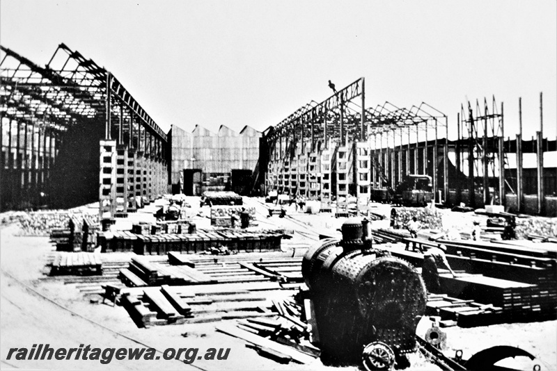 P21275
Building extensions under construction, required to facilitate increased production for the war effort, workers, Midland Workshops, ER line, overall view of building site, c1941
