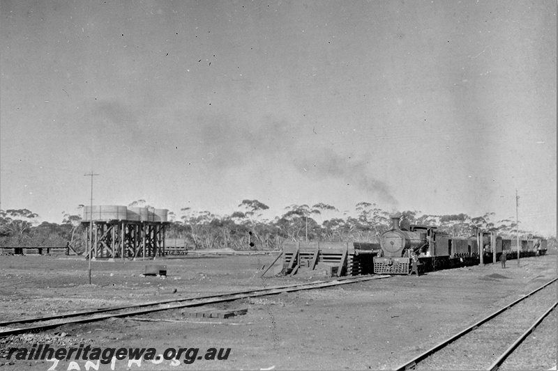 P21343
Zanthus Station yard. Photo shows water tanks and locomotive with ballast  wagons.
