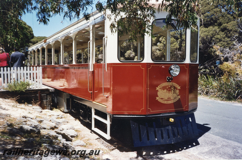 P22418
Rottnest Island Oliver Hill Railway railcar, with insignia on end of carriage, platform, onlookers, Settlement station, Rottnest Island, side and end view
