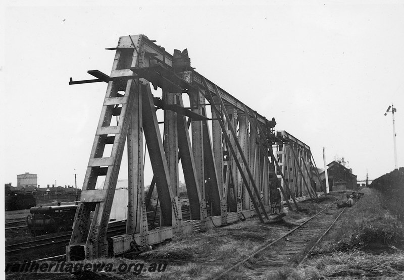P22754
Extension of Mt Lawley subway ER line No 3 of 15, side trusses with stays, track, signal, shed, houses, gasometer, view along tracks looking south
