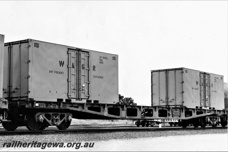 P22876
WFX class 30309 flat wagon, laden with dry freight containers No.5059 and No.5085, end and side view from track level 
