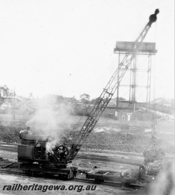 P22885
Rail mounted steam crane, water tower, East Perth loco depot, ER line, side and end view
