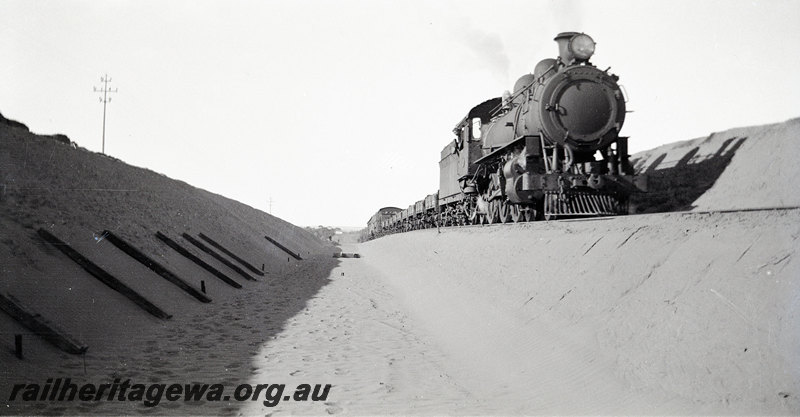 P22913
Regrading & Deviation at Indarra NR line 30 June 1935 4 of 7, steam locomotive on work train, sleepers, cutting, side and front view from trackside
