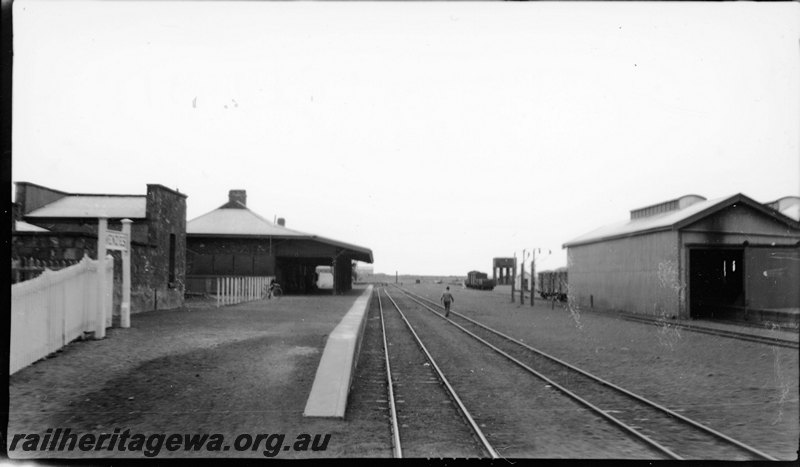 P22927
Platform, station building, station nameboard, goods shed, water tower, tracks, pedestrian, Menzies, KL line, view from trackside along platform
