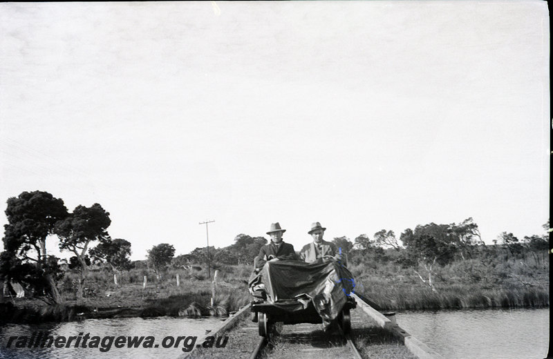 P22934
Three photographs on one print, top photo of motorised trolley with 2 men aboard crossing a river, middle photo of station (same as P22933), and bottom photo of store, Mt Barker,  GSR line
