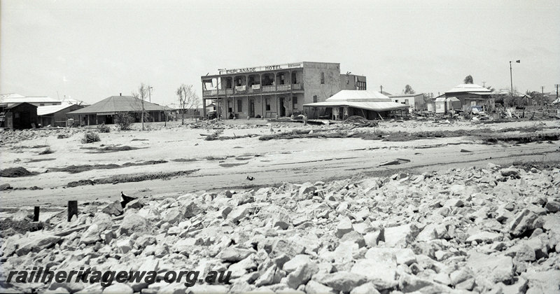 P22935
Aftermath of floods at Port Hedland PM line in January 1939 1 of 3, view of town buildings, ground level view
