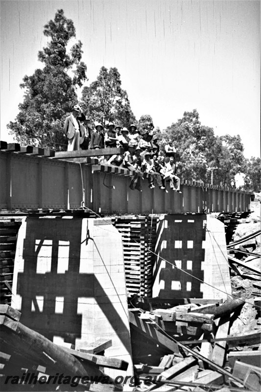 P22965
1 of  5 views of the construction Harvey River bridge. SWR line , view along the side of the bridge, workers sitting on the edge of the girder
