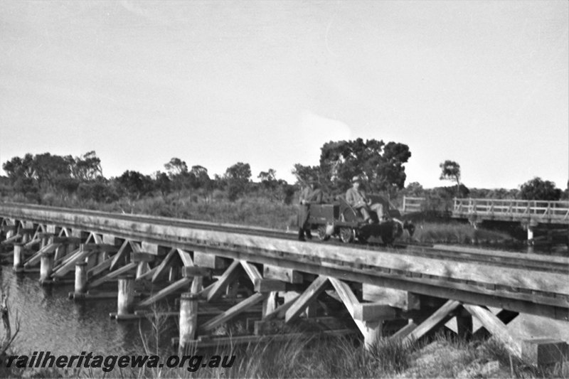 P22978
Hay River bridge near Denmark, D line, motorized trolley with forward facing seats with passengers on the bridge
