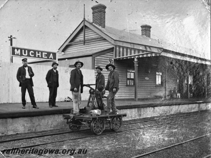 P23023
Hand trolley with 3 men on board, station building, 2 men on platform, tracks, Muchea, MR line, Midland Railway Co era, view from track level
