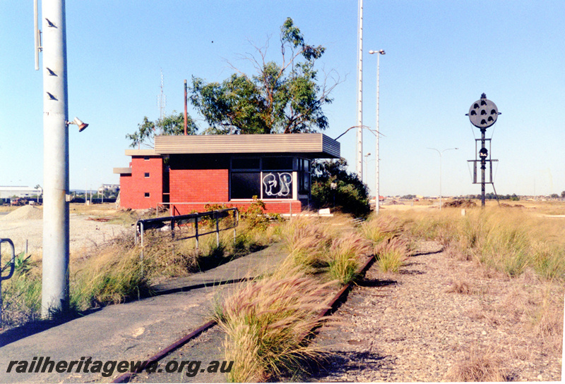 P23102
Forrestfield Hump Yard 2 of 6, shunter's cabin, hump signal, overgrown track, light poles, track level view
