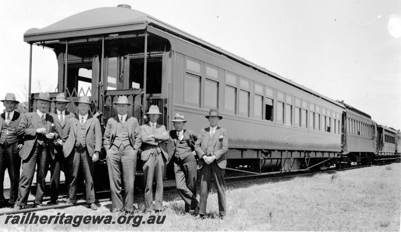 P23130
AM class 313 Commissioner's carriage, on train, 8 hatted and suited officials, end and side view from track level
