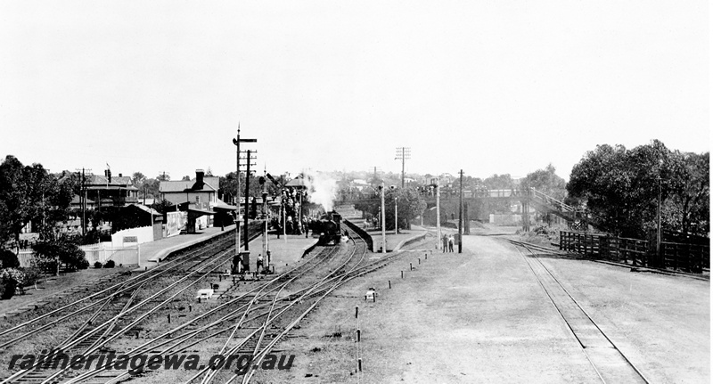 P23138
Platforms, station buildings, signals , onlookers, scissors crossover, crossover,  steam-hauled  passenger train at station, Claremont, ER line, view from elevated position, Royal Show train
