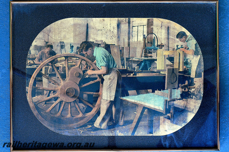 P23143
Pattern Shop, Midland Workshops, patternmaker using a spokeshave on an E class driving wheel pattern, colourized photo
