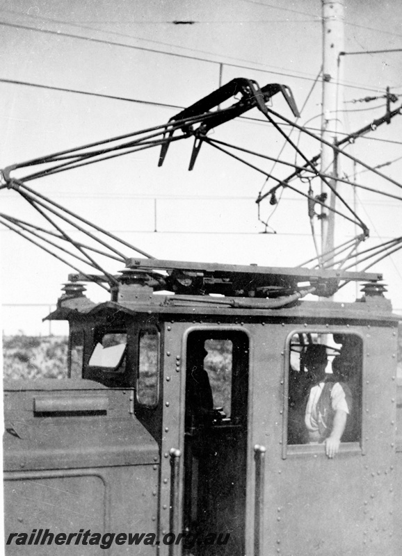 P23146
 State Electricity Commission electric locomotive 1, 2 of 6, driver George Miller, cab close up view, c1930s
