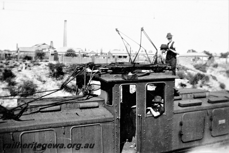 P23148
 State Electricity Commission electric locomotive 1, 4 of 6, crew including driver George Miller, upper side view, c1930s
