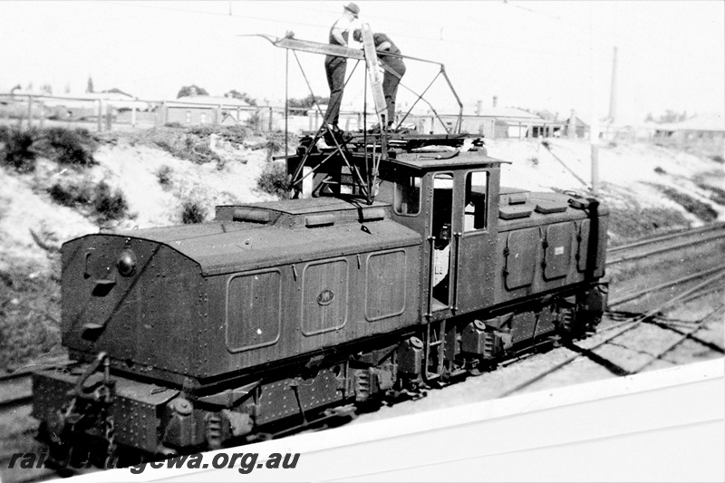 P23150
 State Electricity Commission electric locomotive 1, 6 of 6, crew on roof of cab, end and side view, c1930s
