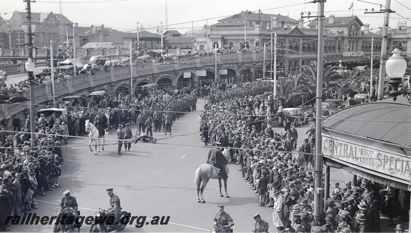 P23173
Military parade, men on horses and motorbikes, crowds, horseshoe bridge, Perth station, ER line, elevated view 
