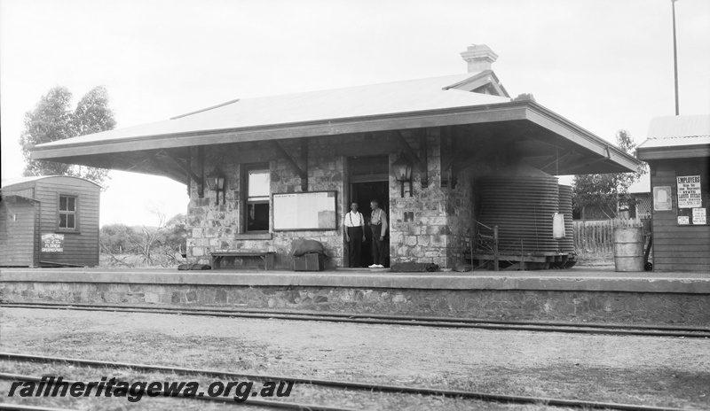 P23254
Masonry Traffic Office, masonry platfrom face, Northampton Railway Station. Employees standing in doorway. trackside view, GA line.
