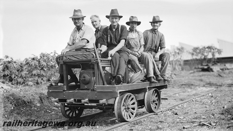 P23282
Group of gangers raiding on a motorised ganger's  trolly. 
