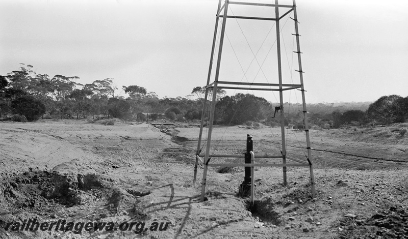 P23340
Koorda water supply - original dam and part of windmill pump. WLB line.
