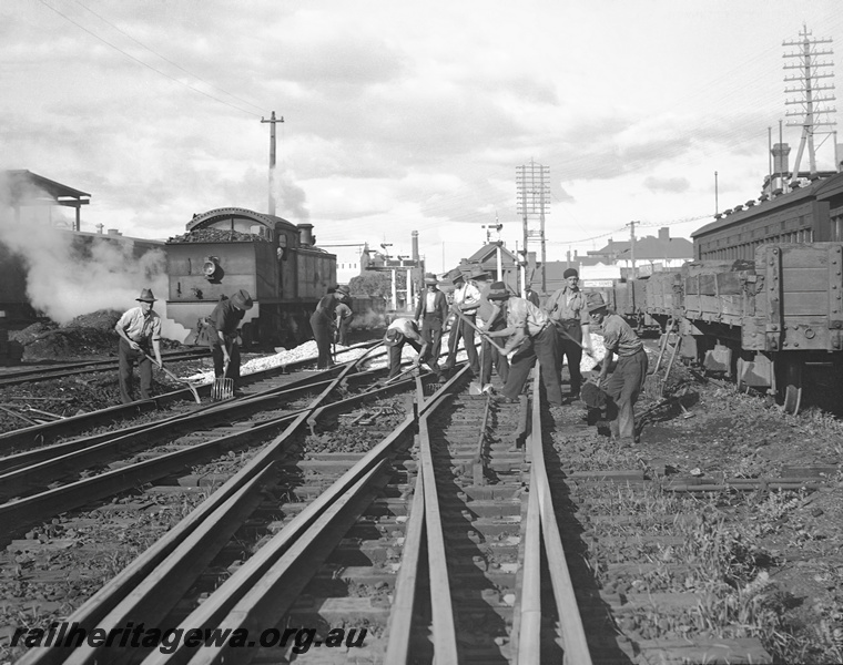 P23345
Per way gang working on lines near Perth. D class locomotive in background. ER line., see also P2321
