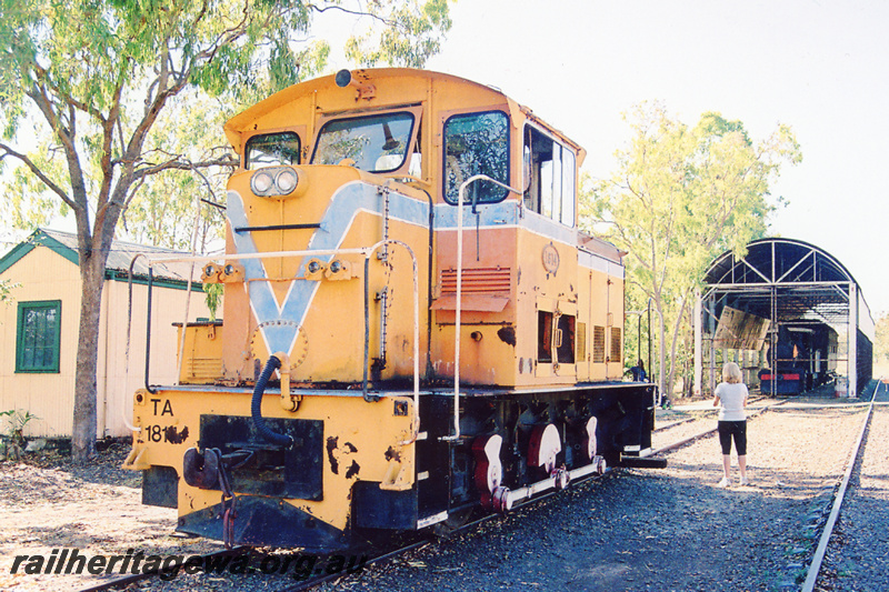 P23360
TA class1814 0-6-0 diesel electric locomotive in the Westrail orange with blue stripe livery, Pine Creek, Northern Territory, front and side view
