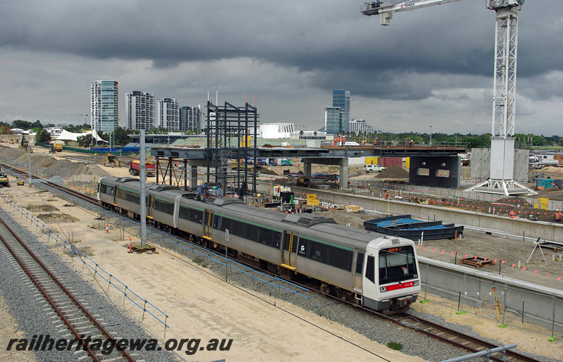 P23372
AEA class 212, AEB class 312, EMU set 12, passing Perth Stadium construction works, casino backdrop, SWR line, side and end view from elevated position
