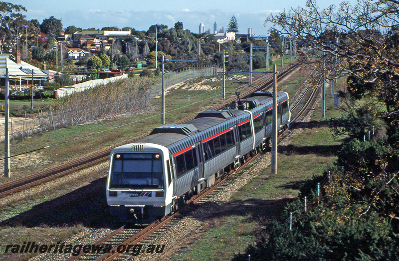 P23374
AEB class 314, AEA class 214, EMU set 14, overhead wires, tracks, houses, Success Hill, ER line, end and side view from elevated position
