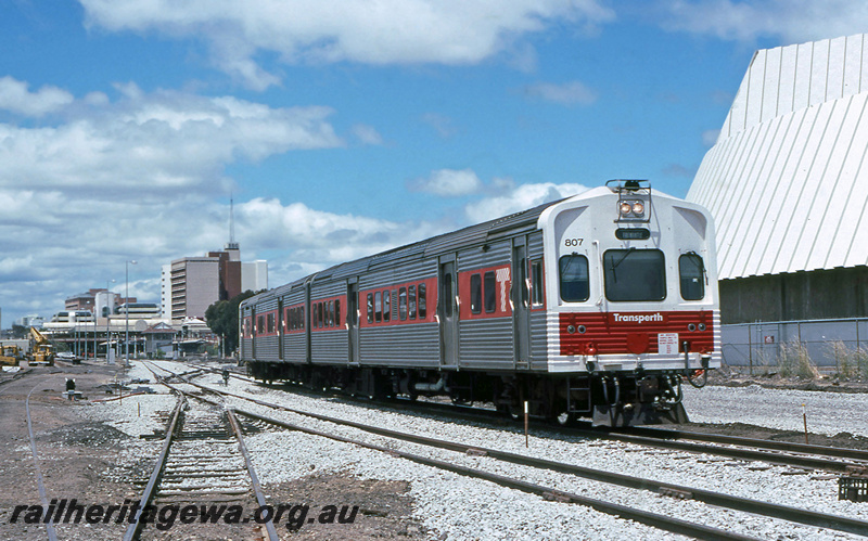 P23402
ADL class 807, on DMU set, trackwork, city buildings, Perth, ER line, side and end view
