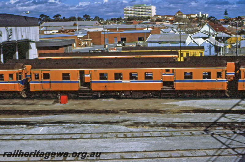 P23406
ADX class 666 railcar, other carriages, shed, suburban backdrop, tracks, Claisebrook ER line, side view from elevated position
