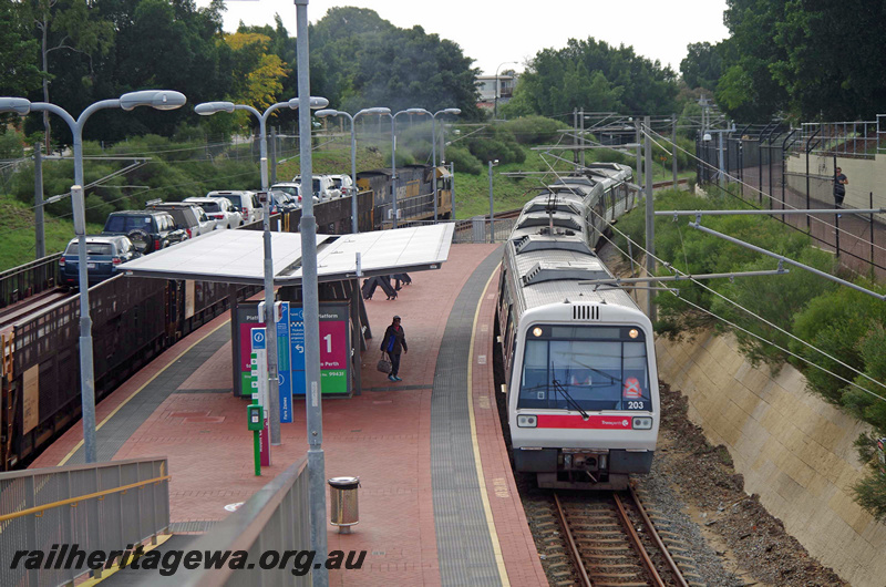 P23407
AEA class 203, AEB class 303, EMU set 03, platform, canopy, ramp, diesel hauled car transporter passing, Mount Lawley, ER line, front and top view from elevated position
