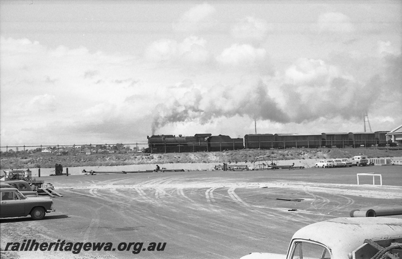 P23411
S class steam loco on goods train of vans and wagons, carpark,  North Fremantle, ER line, side view
