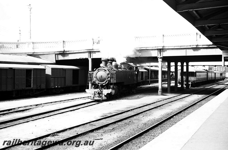 P23415
DD class 592, vans, passenger carriages, overhead road bridge, tracks, platform edge, Perth city station, ER line, front and side view
